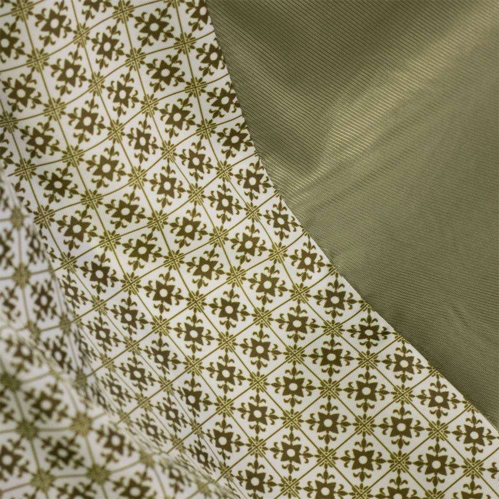 Close-up of fabric with geometric pattern and solid color swatch