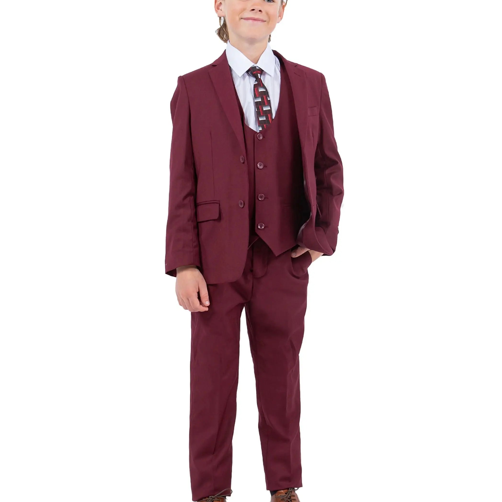 Child wearing a maroon suit with a white shirt and tie on a white background
