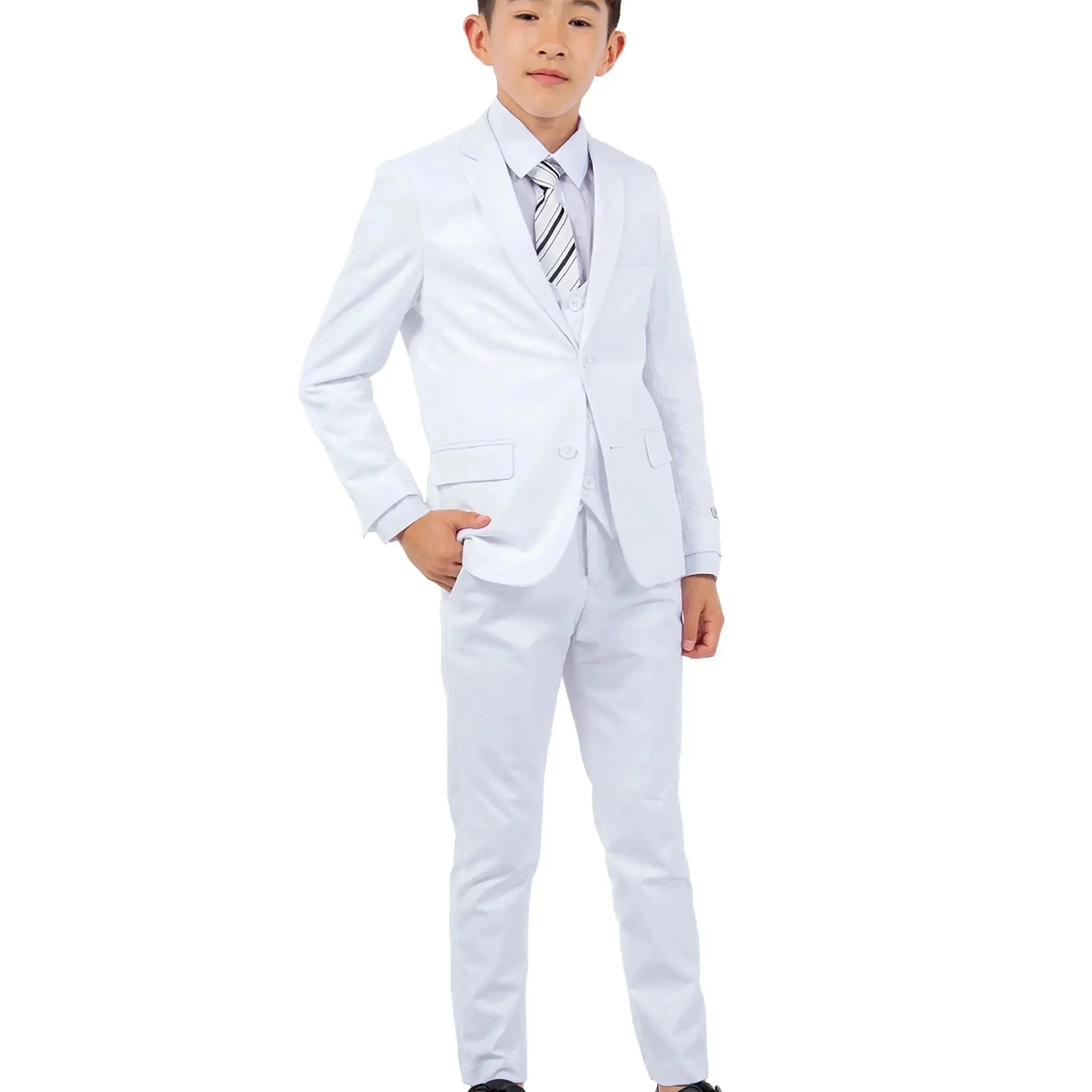 Young boy wearing a white suit with a striped tie on a white background