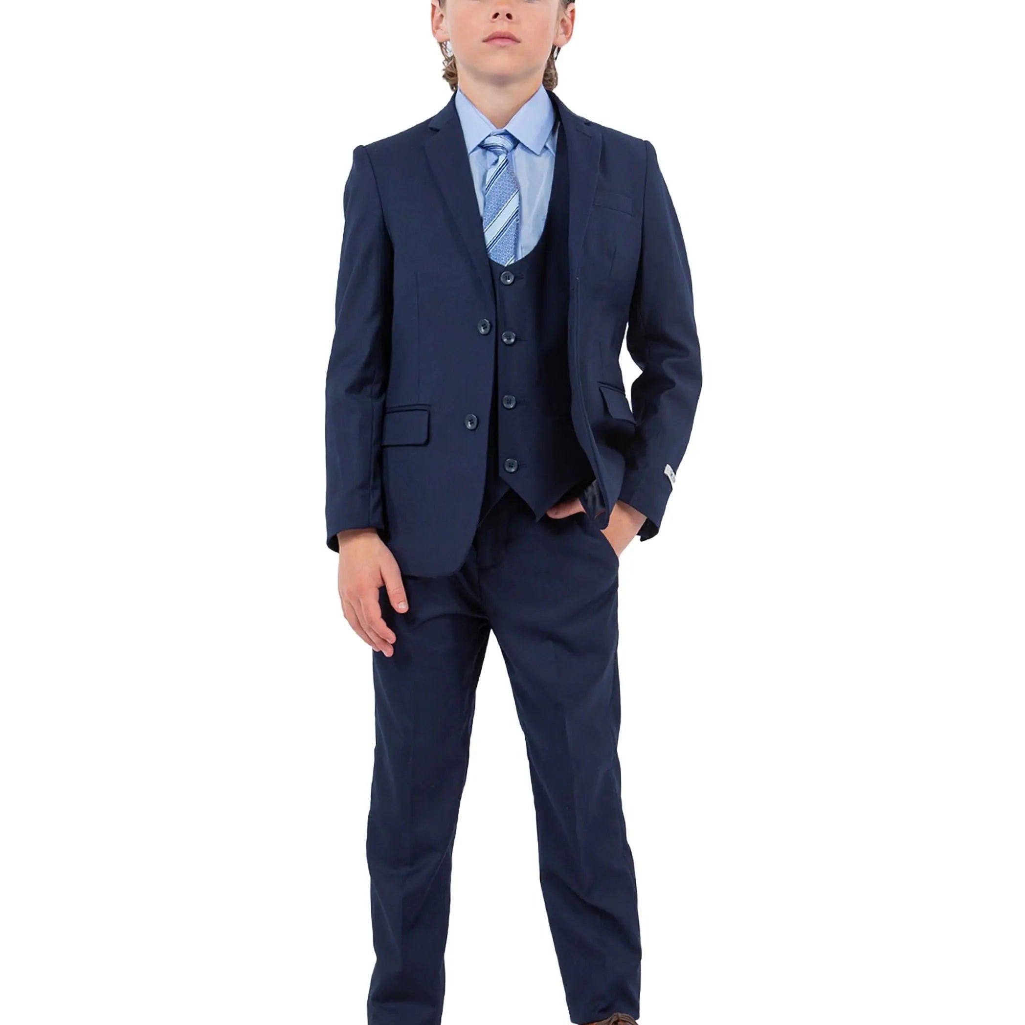 Child wearing a navy blue suit with a white shirt and brown shoes on a white background