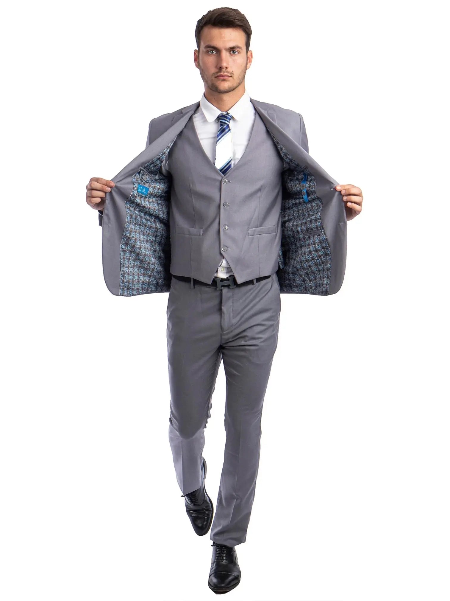Model wearing a M & R Clothing grey skinny-fit 3-piece suit with a patterned jacket lining and matching waistcoat.