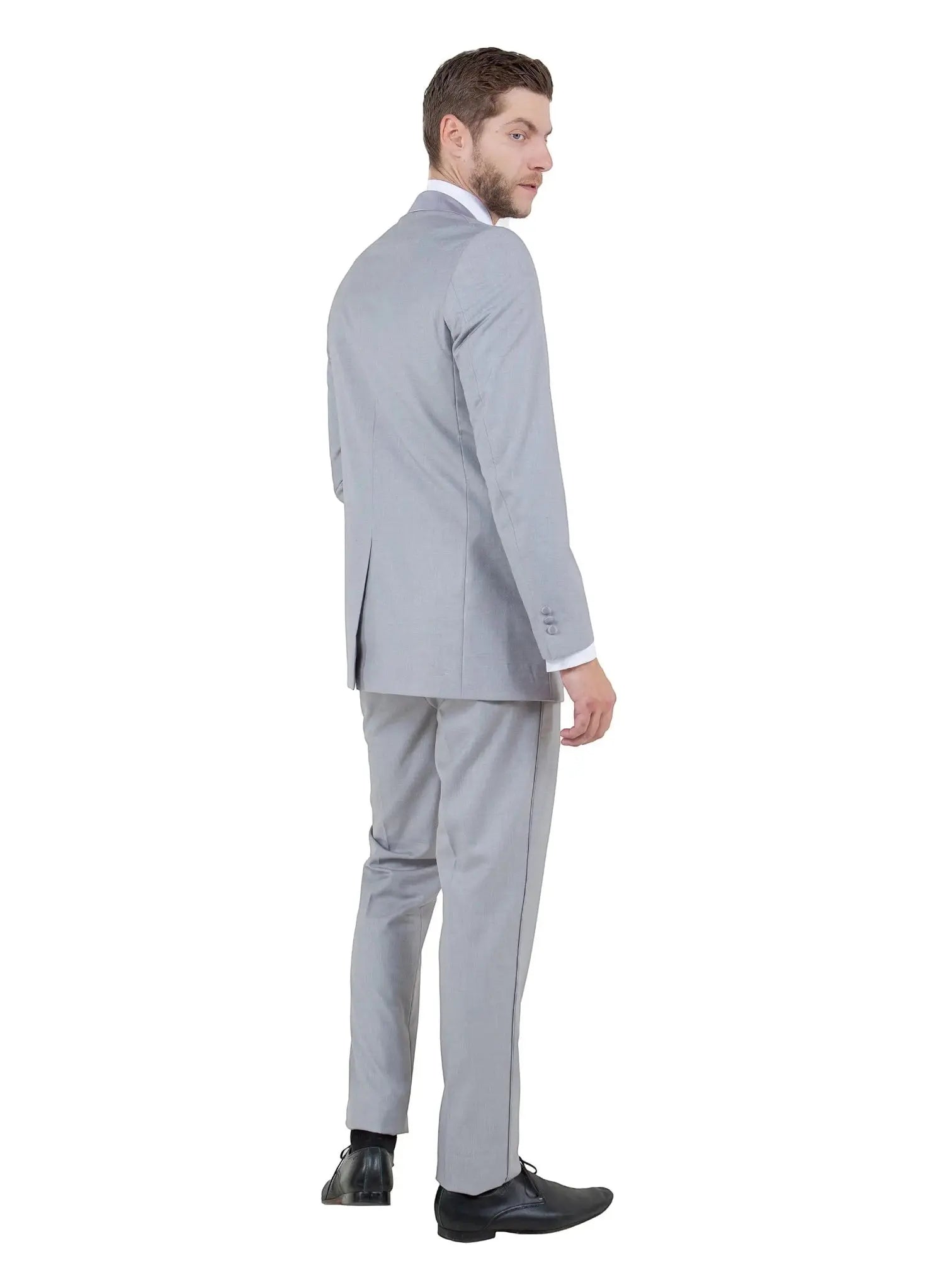 M & R Clothing Bryan Michaels grey tailored suit jacket and trousers worn by a man looking over his shoulder