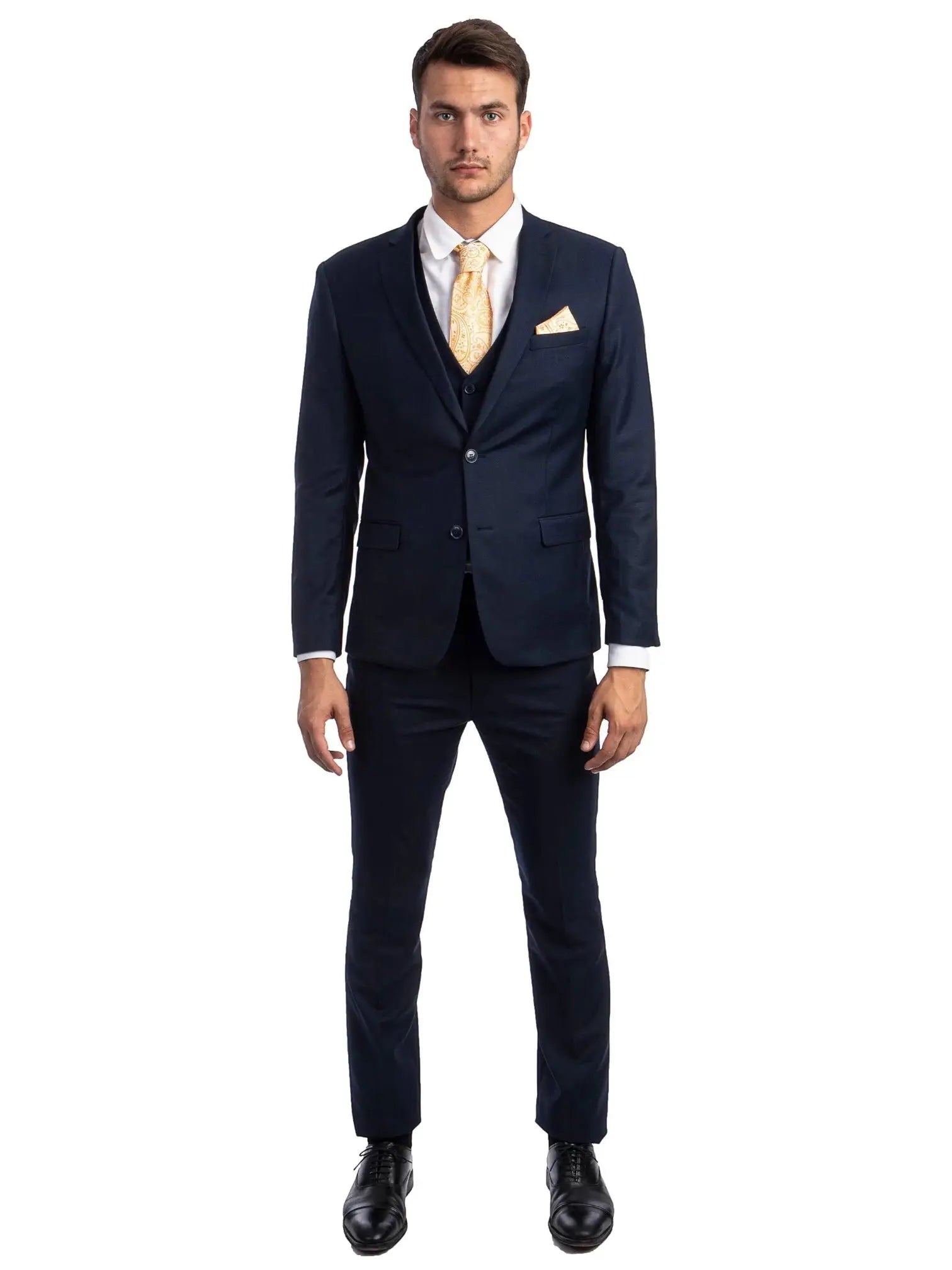 A man wearing a M & R Clothing navy blue skinny-fit 3-piece suit with a white shirt, yellow tie, and black shoes.