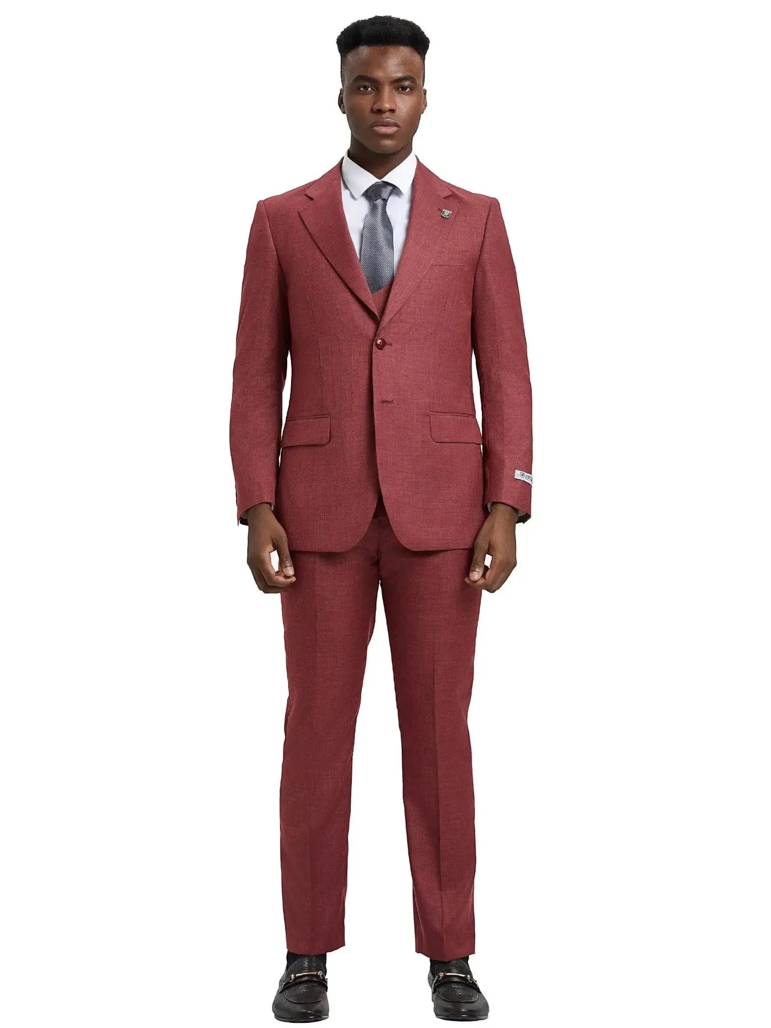 A man wearing a M & R Clothing Stacy Adams 3-piece sharkskin suit in deep red with a white shirt and grey tie.