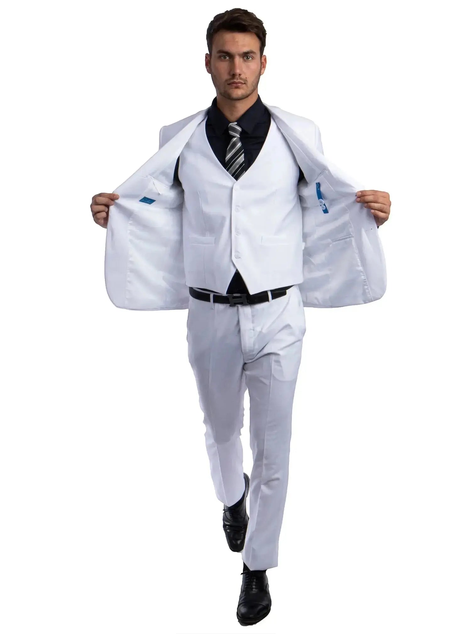 Model wearing a white M & R Clothing skinny-fit 3-piece suit with a black shirt and tie, jacket open to show vest.