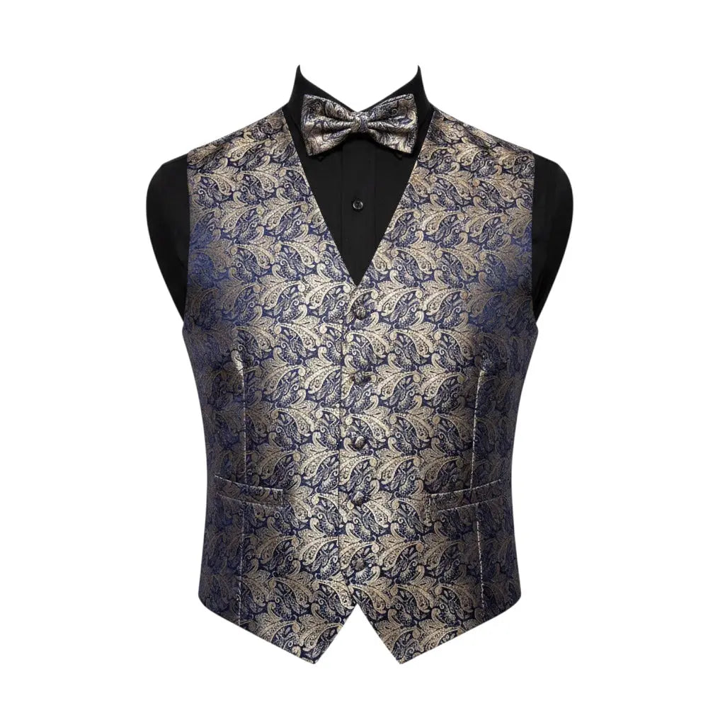 A men's formal vest with a matching bow tie, displayed on a black mannequin torso against a plain white background. The vest features an intricate, woven damask pattern in navy blue and gold, while the inner shirt is black.