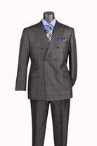 A dark gray double-breasted suit with a subtle windowpane check pattern, displayed on a mannequin torso with a light blue dress shirt, a blue and gray patterned tie, and a matching pocket square.