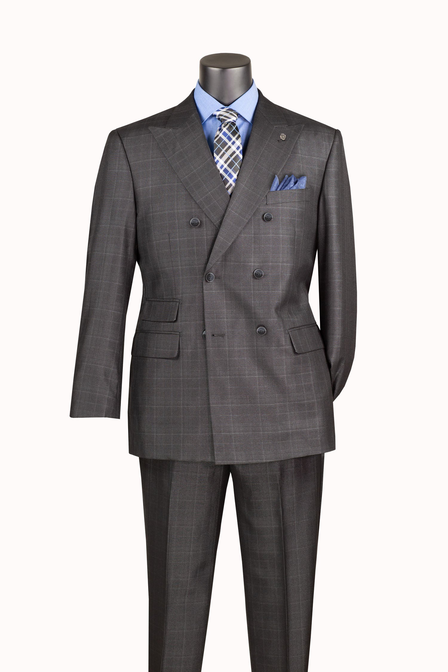 A dark gray double-breasted suit with a subtle windowpane check pattern, displayed on a mannequin torso with a light blue dress shirt, a blue and gray patterned tie, and a matching pocket square.