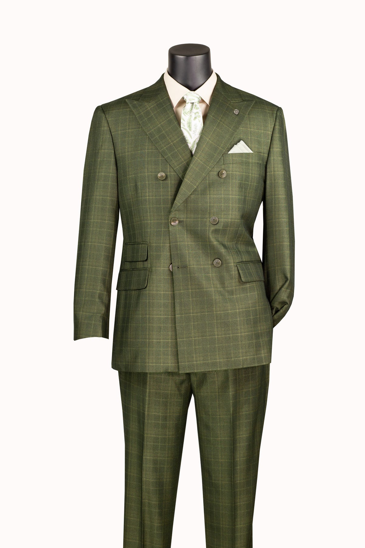 An olive green double-breasted suit with a subtle windowpane plaid pattern, displayed on a mannequin torso with a cream shirt and patterned tie.