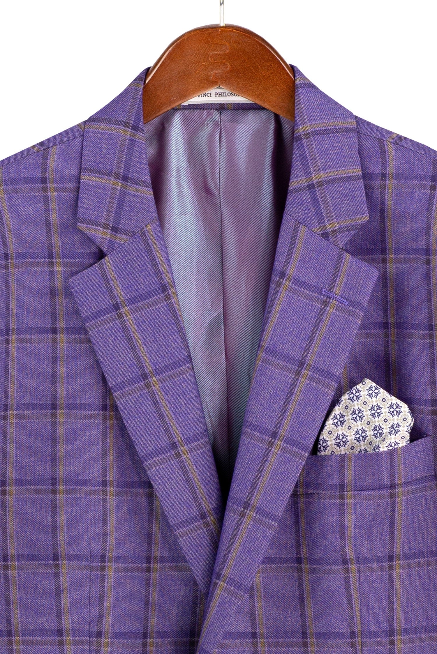 A purple plaid blazer jacket with a patterned pocket square, hanging on a wooden hanger against a white background.