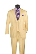 Beige suit with a purple shirt and floral tie on a mannequin against a white background