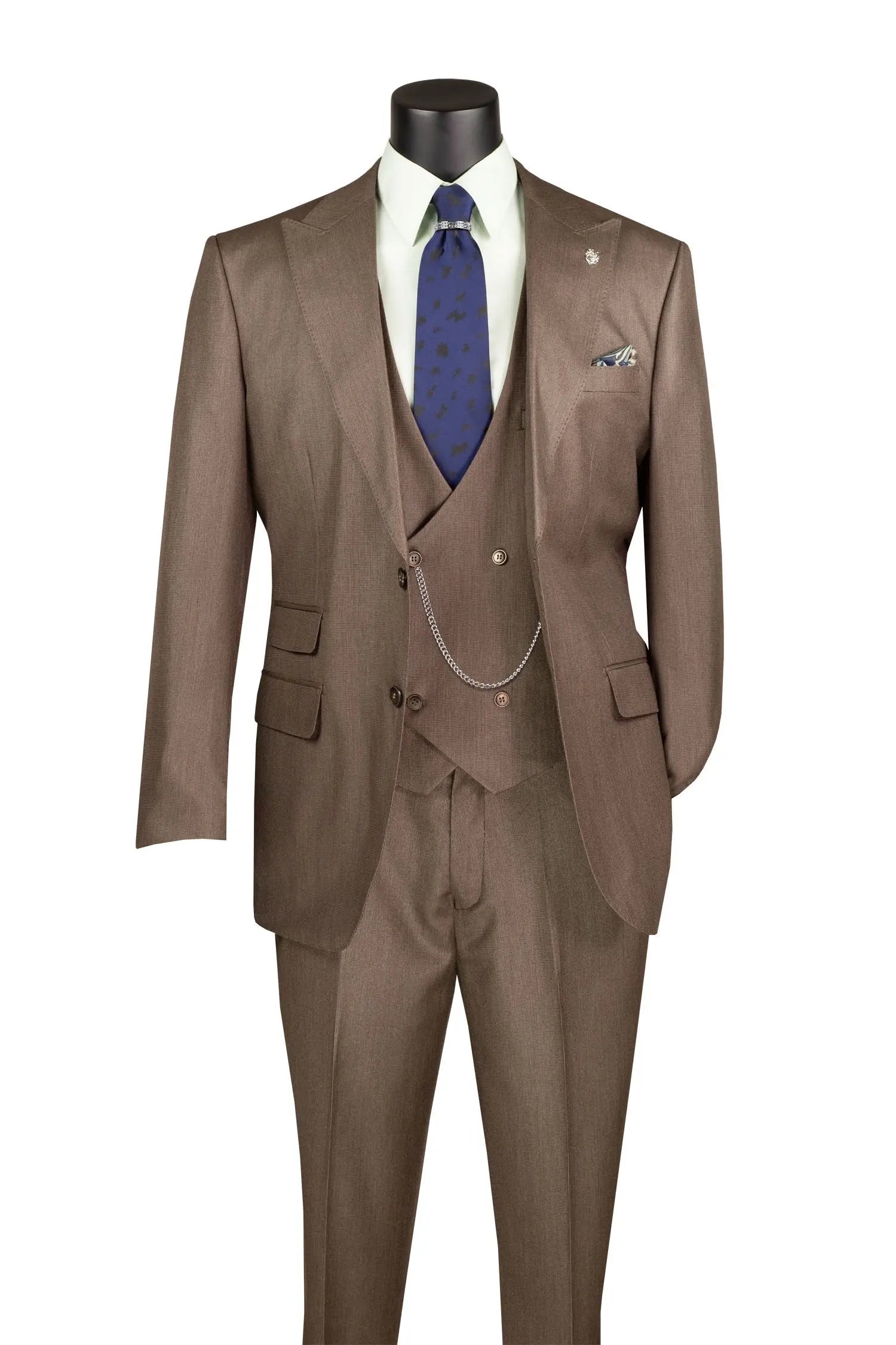 A three-piece brown suit displayed on a black mannequin torso, styled with a white dress shirt, a blue patterned tie, and a matching pocket square against a plain white background.