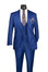 A men's three-piece suit in a vibrant royal blue, displayed on a black mannequin torso. The suit includes a jacket, matching vest, and trousers, styled with a white dress shirt, a patterned paisley tie, and a matching pocket square with gold chain accessories.