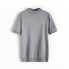 A light gray short-sleeve knit top with a mock neck and ribbed cuffs and hem, displayed flat against a white background.