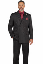 A man wearing a black double-breasted pinstripe suit with a red patterned tie and matching red pocket square, photographed against a plain white background.
