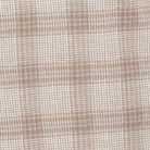 A close-up of a woven fabric with a subtle plaid pattern in beige and off-white.
