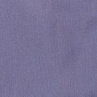 A close-up of a textured fabric with a fine woven pattern in a muted periwinkle or dusty purple-blue color.