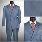 Blue suit with patterned tie and pocket square on a mannequin, close-up of fabric texture.