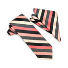 A striped necktie and matching pocket square set on a plain white background. The fabric features alternating stripes of black, textured charcoal gray, coral pink, and cream.