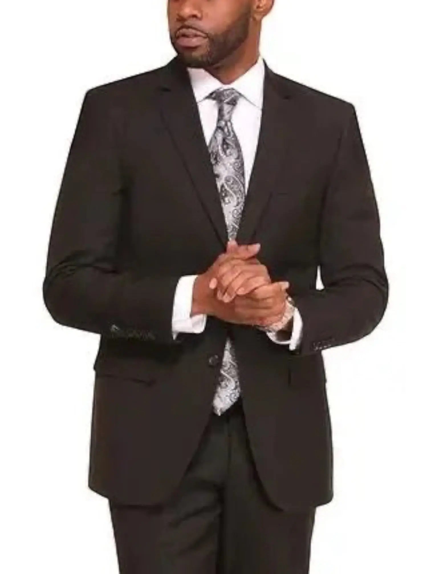 A man wearing a M & R Clothing black 2-piece suit with a white shirt and patterned grey tie for a formal look.
