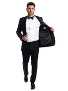 M & R Clothing men's black 2-piece tuxedo with satin shawl collar, white pleated shirt, and bowtie on a model.