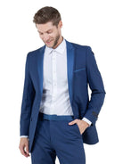 M & R Clothing Bryan Michaels blue tuxedo jacket with satin peak lapel worn by a man with a white dress shirt
