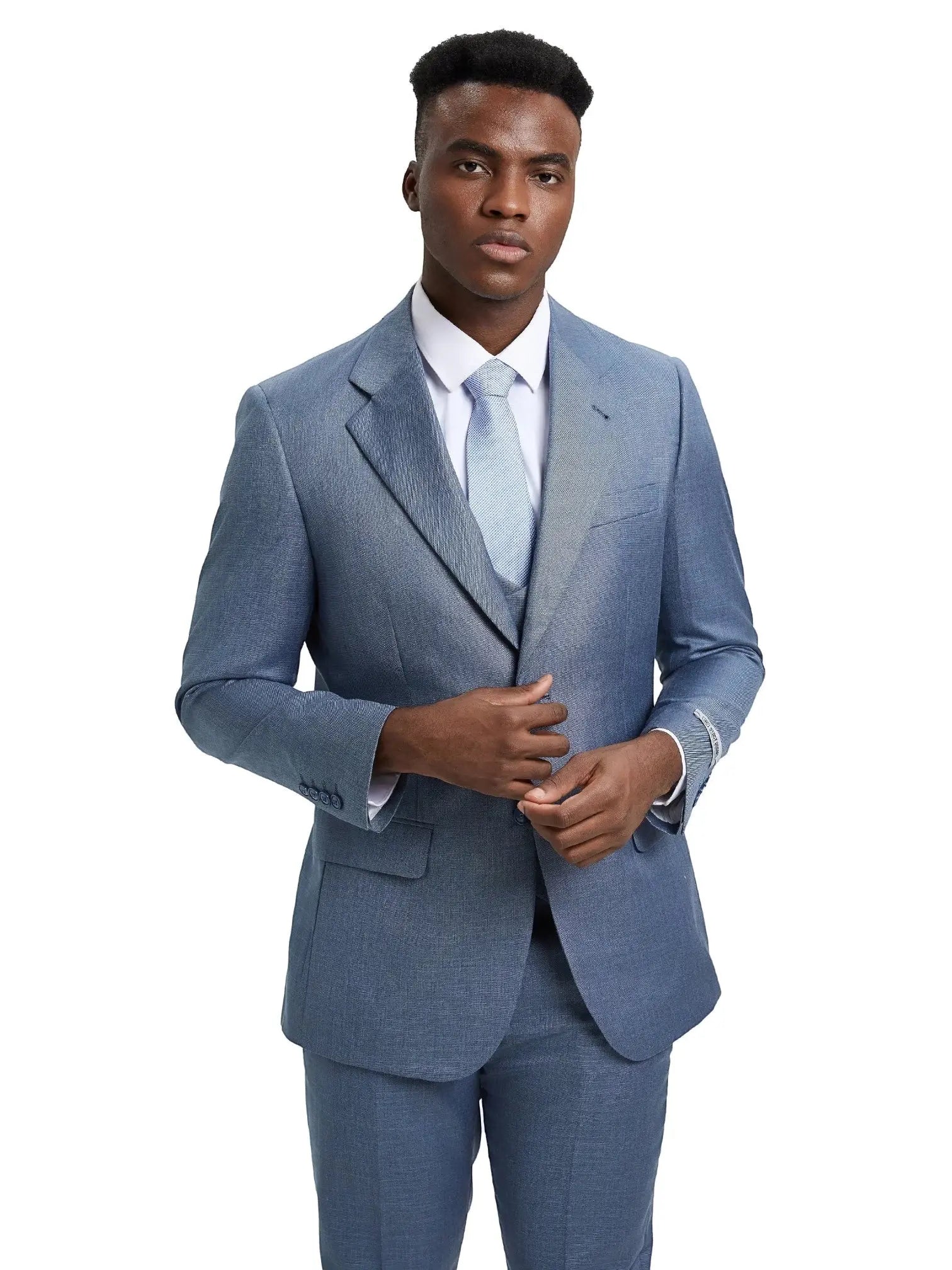Model wearing a blue M & R Clothing sharkskin 3-piece suit with a white shirt and light blue tie