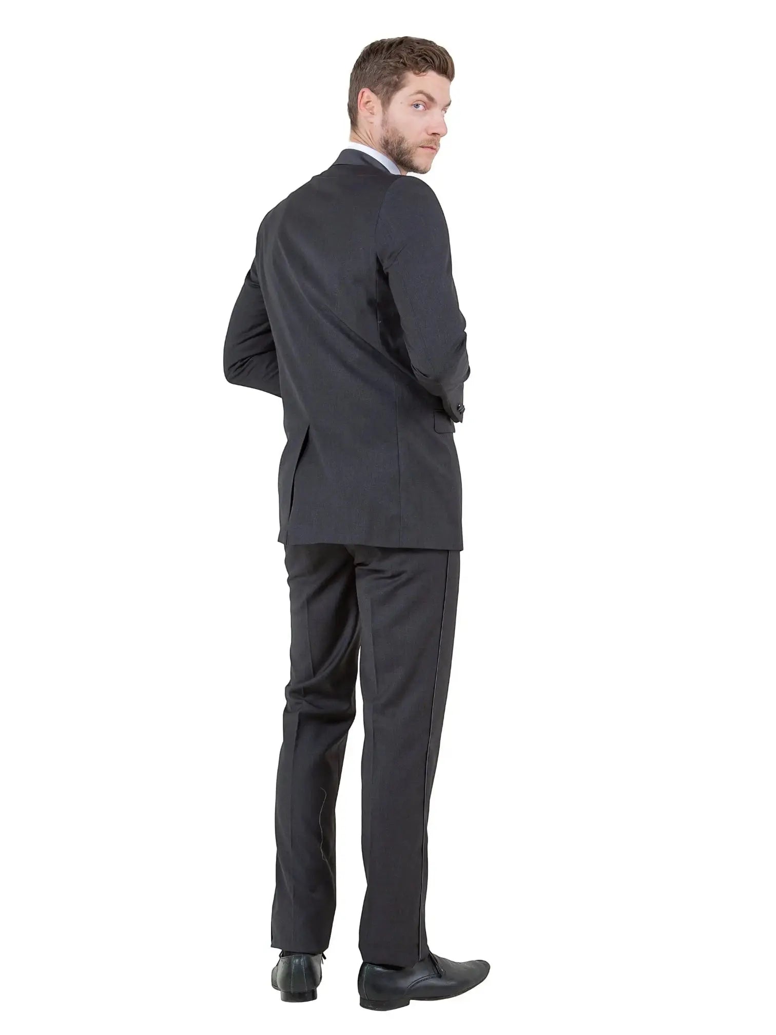 M & R Clothing Bryan Michaels black tuxedo jacket with satin peak lapel worn by a man looking over his shoulder