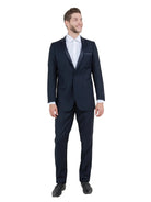 M & R Clothing Bryan Michaels black tuxedo with satin peak lapel worn by a smiling man in a white dress shirt