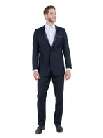 M & R Clothing Bryan Michaels black tuxedo with satin peak lapel worn by a smiling man in a white dress shirt