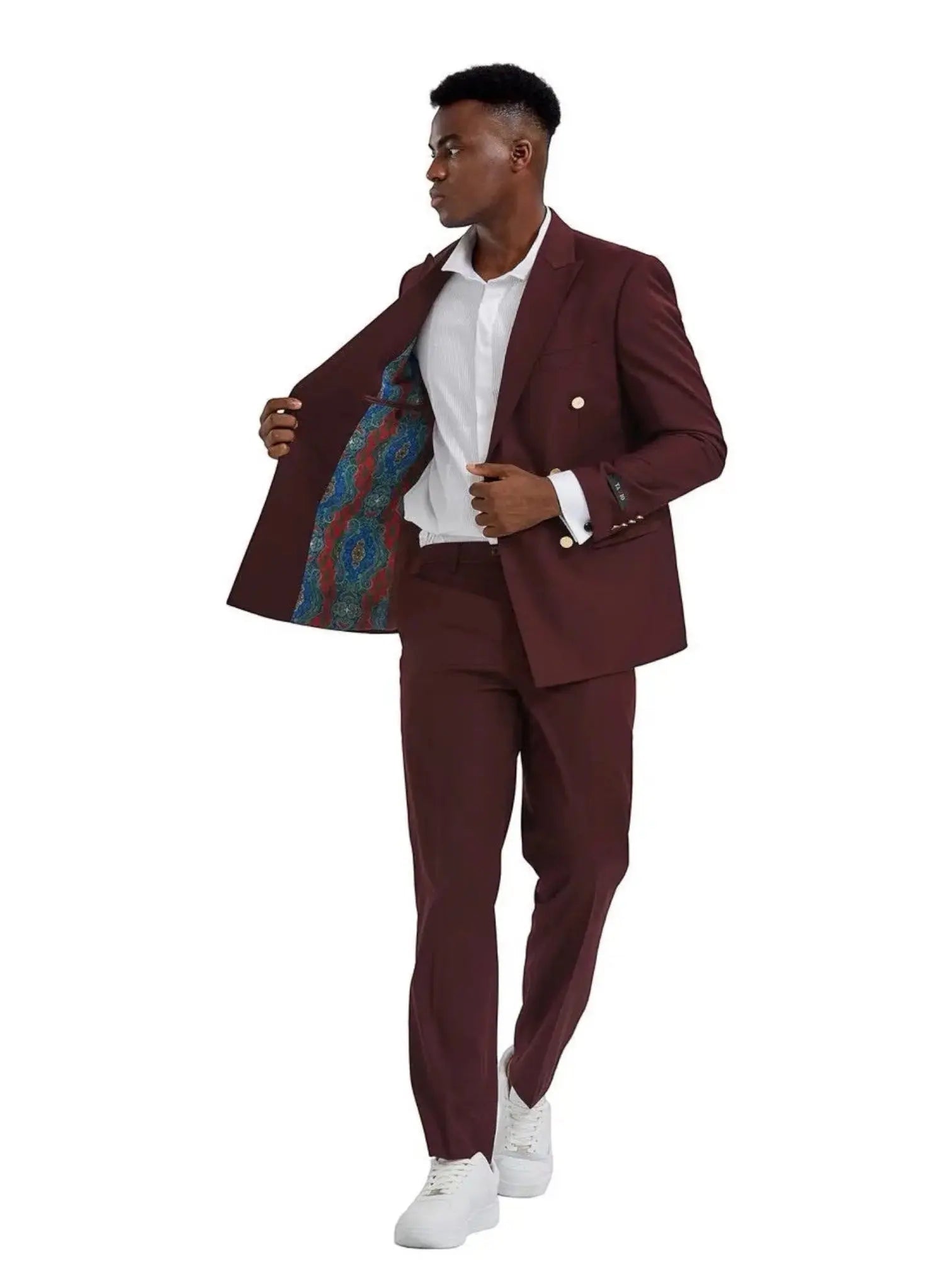 M & R Clothing burgundy double breasted suit with peak lapels and gold buttons worn by a man with white sneakers