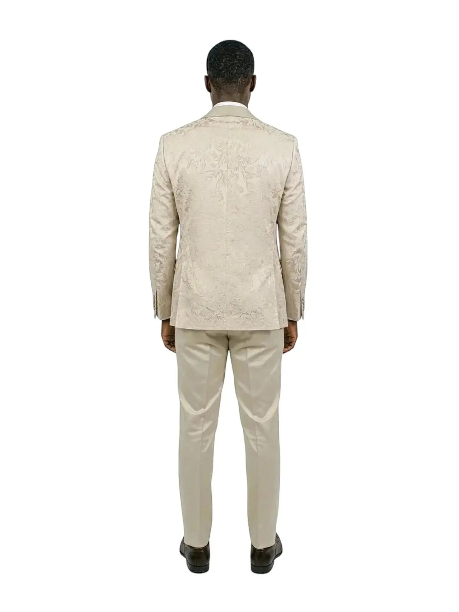 Back view of a man wearing a M & R Clothing champagne jacquard 3-piece tuxedo suit with a skinny fit silhouette.