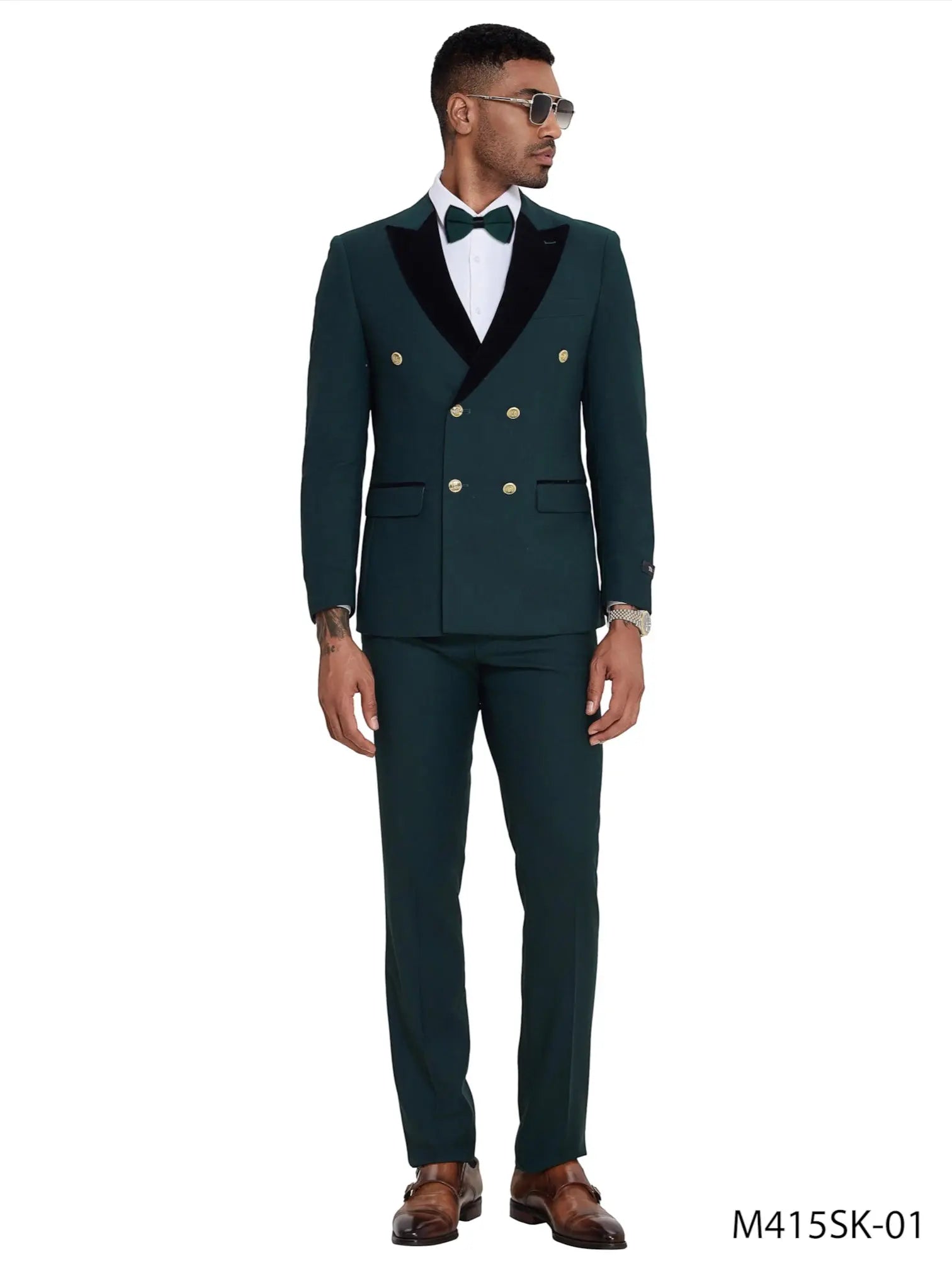 Model wearing a M & R Clothing dark green double-breasted suit with black satin peak lapels and gold buttons.