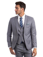 Model wearing a grey M & R Clothing skinny-fit 3-piece suit with a white shirt, striped tie, and pocket square.
