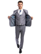 Model wearing a M & R Clothing grey skinny-fit 3-piece suit with a patterned jacket lining and matching waistcoat.