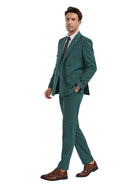 M & R Clothing hunter green pinstripe double-breasted slim fit suit worn by a man with brown leather dress shoes