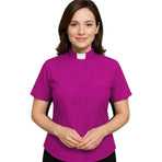 Woman wearing a magenta M & R Clothing short sleeve clergy shirt with a classic white tab collar on a white background