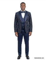 Model wearing a navy Tazio 3-piece velvet and sequin tuxedo suit set with a satin shawl collar from M & R Clothing