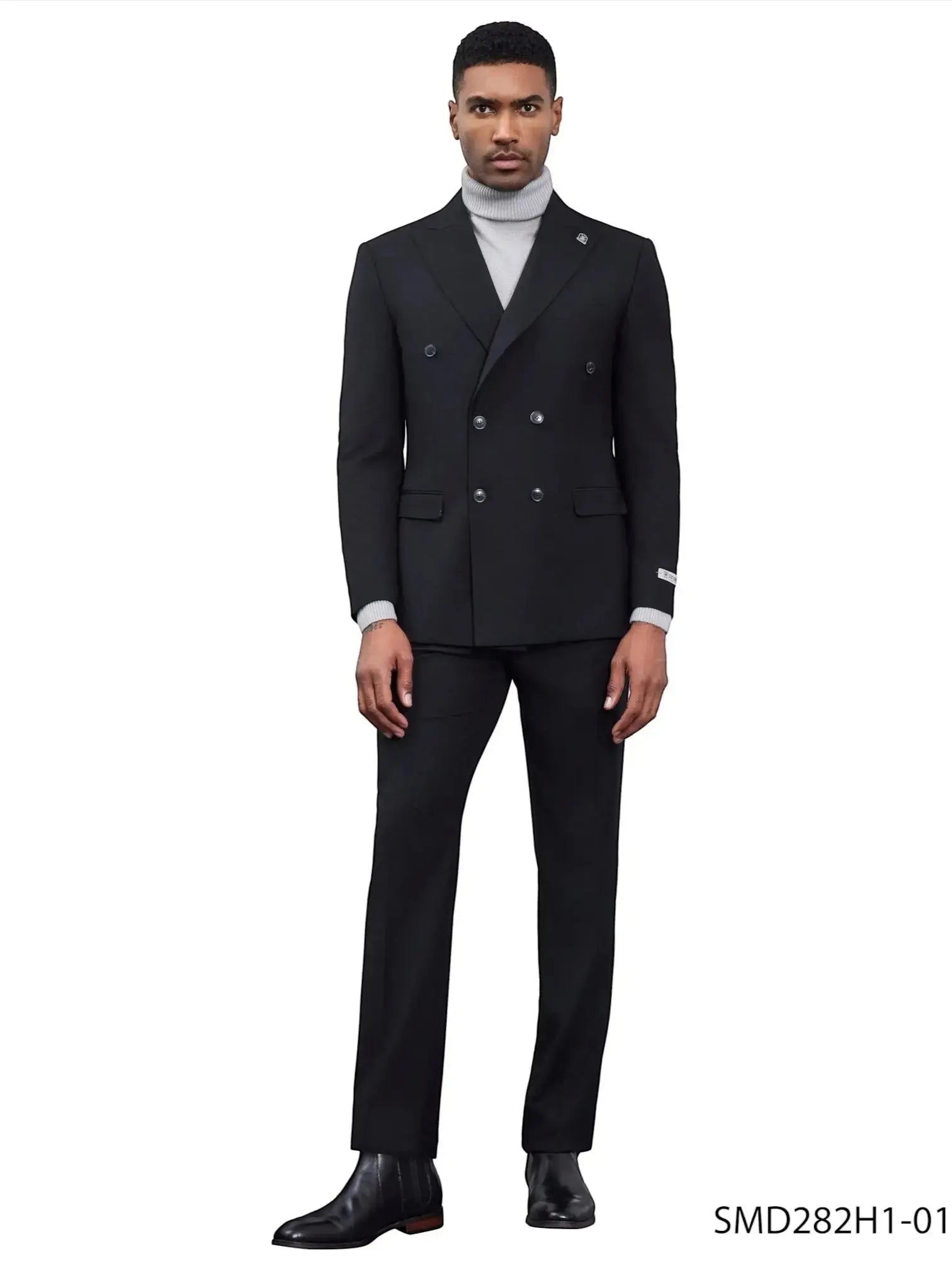 Model wearing a black M & R Clothing Stacy Adams double breasted suit with a grey turtleneck and black dress boots.