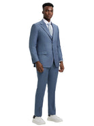 Model wearing a blue M & R Clothing Stacy Adams 3-piece sharkskin suit with a vest, white shirt, and white sneakers.