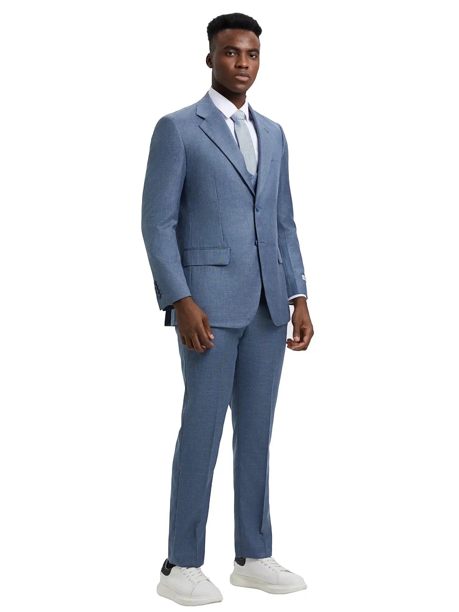 Model wearing a blue M & R Clothing Stacy Adams 3-piece sharkskin suit with a vest, white shirt, and white sneakers.