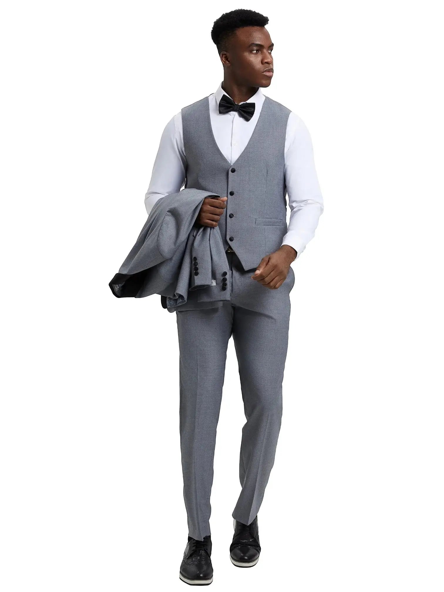 Model wearing a grey M & R Clothing Stacy Adams 3-piece tuxedo set with a vest, flat-front pants, and bowtie.