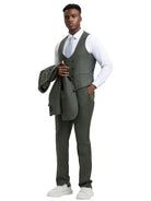Model wearing a M & R Clothing Stacy Adams olive green sharkskin 3-piece suit with a white shirt and light blue tie.